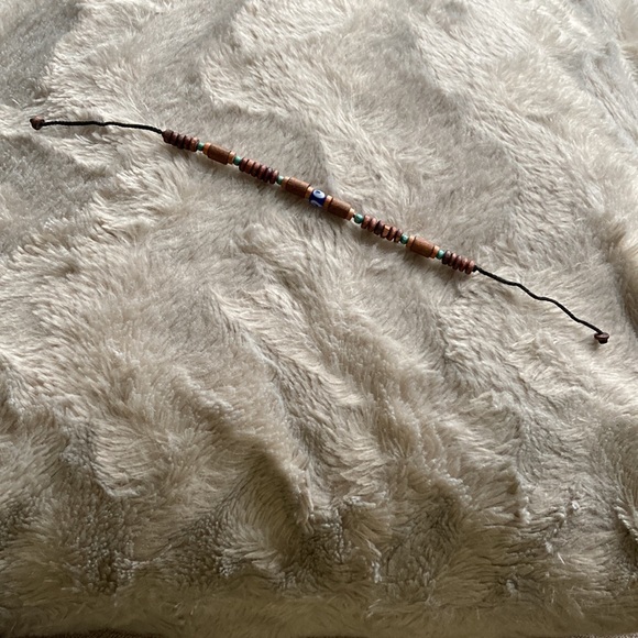 Bracelet with wooden beads and an evil eye bead in the center - Picture 2 of 3